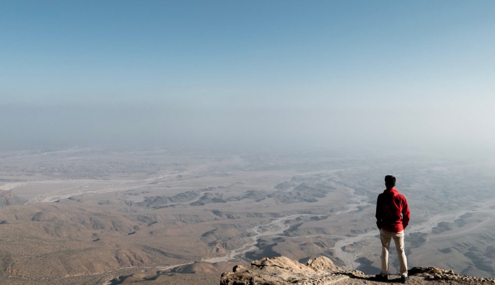 man overlooking Omani landscape