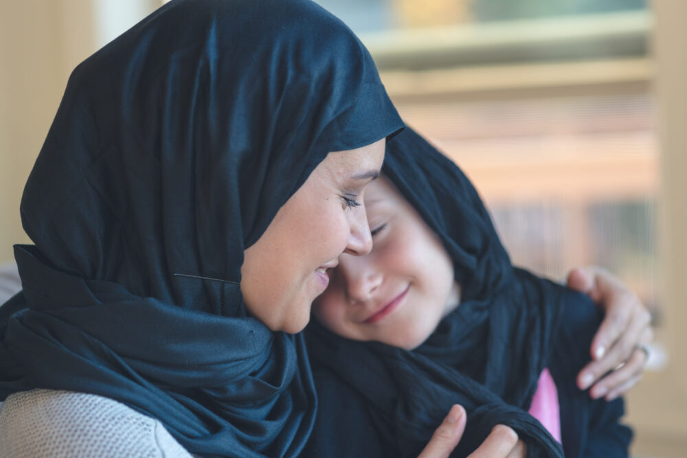 Mother and daughter hugging