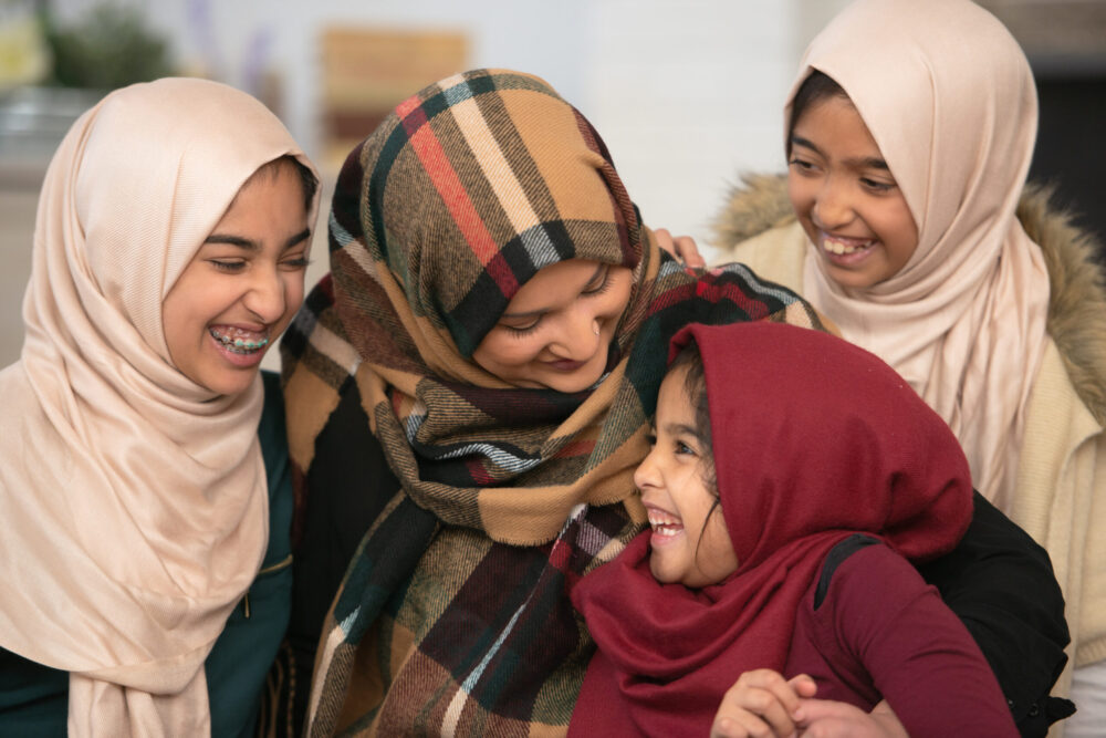 Laughing mother and daughters