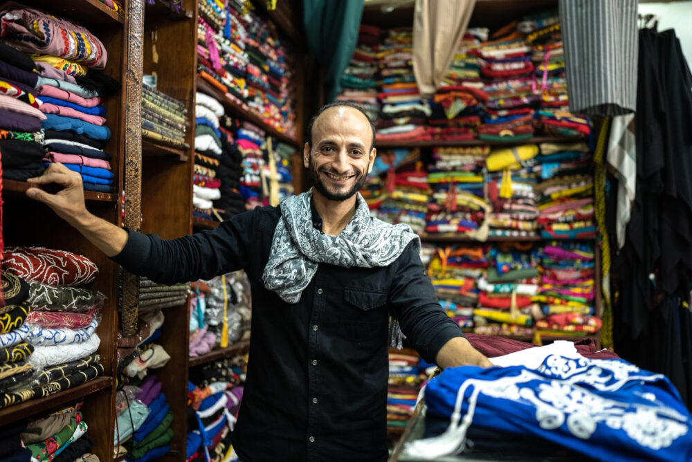 Smiling Muslim store owner