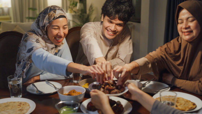 Muslim family breaking the fast