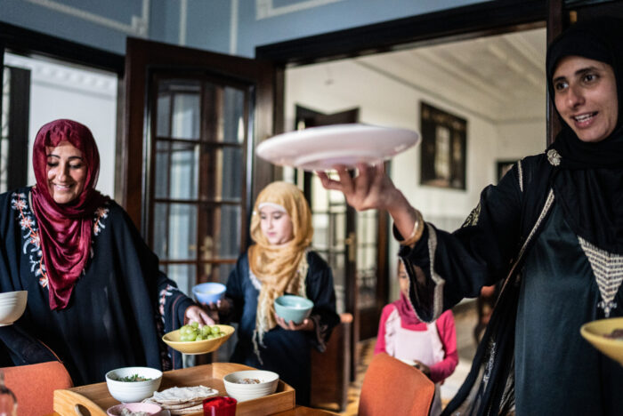 Muslim woman serving food