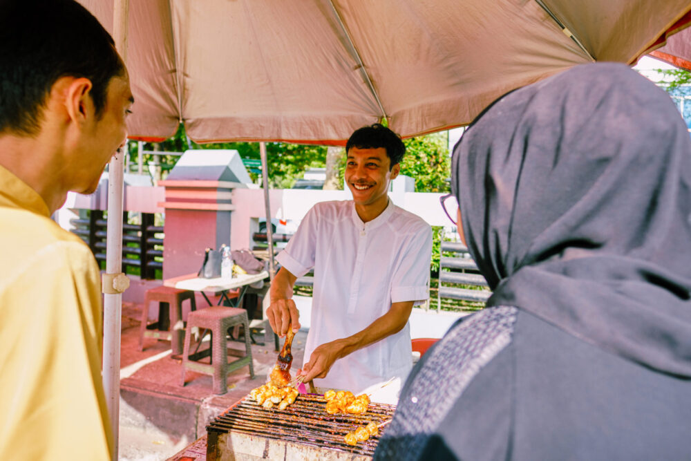 Smiling food vendor