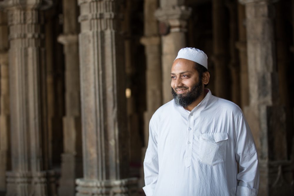 Muslim man smiling in mosque