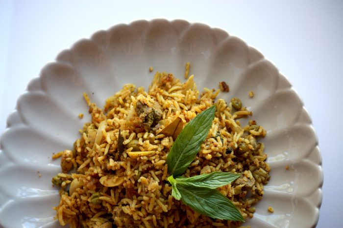 a plate of lamb biryani