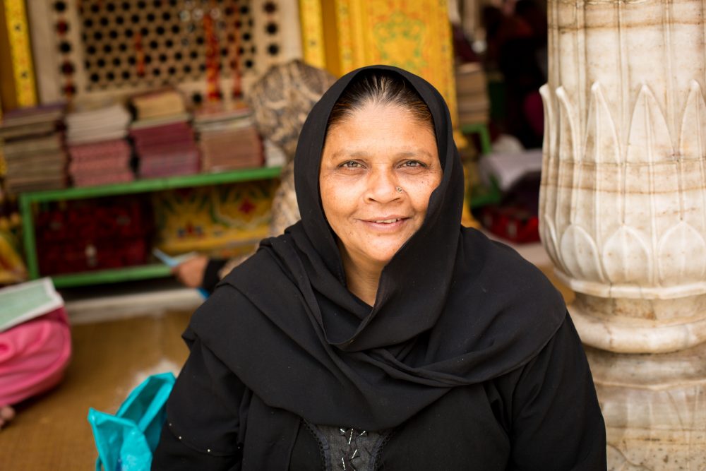 smiling woman in black veil