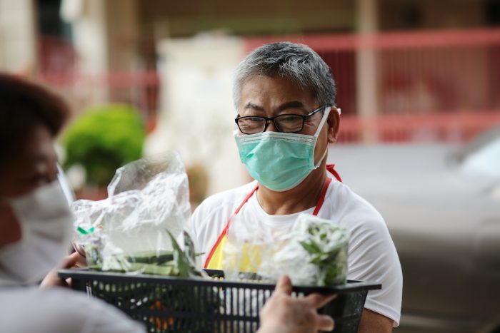 a man helping deliver food