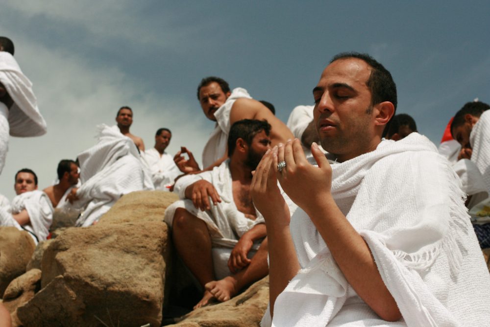 Muslim man praying at Arafat