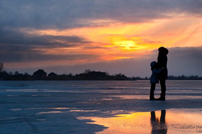 winter silhouette of woman and child