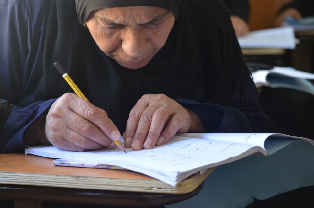 elderly Syrian woman learns to write