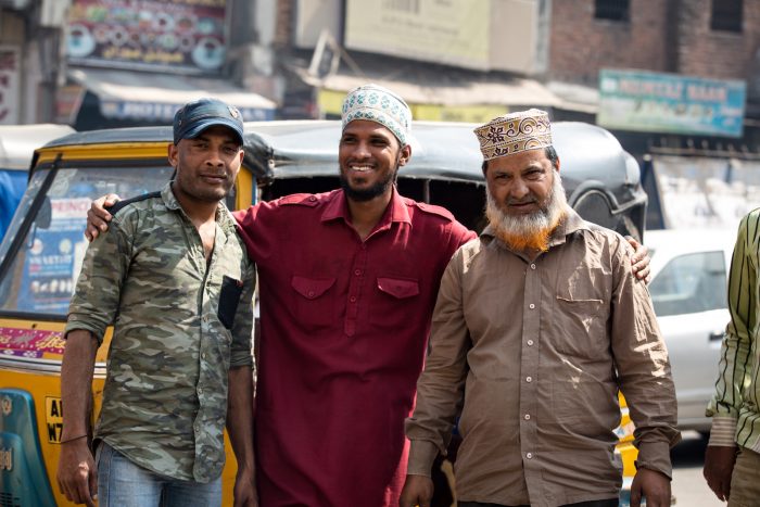 three Indian men in a Muslim neighborhood