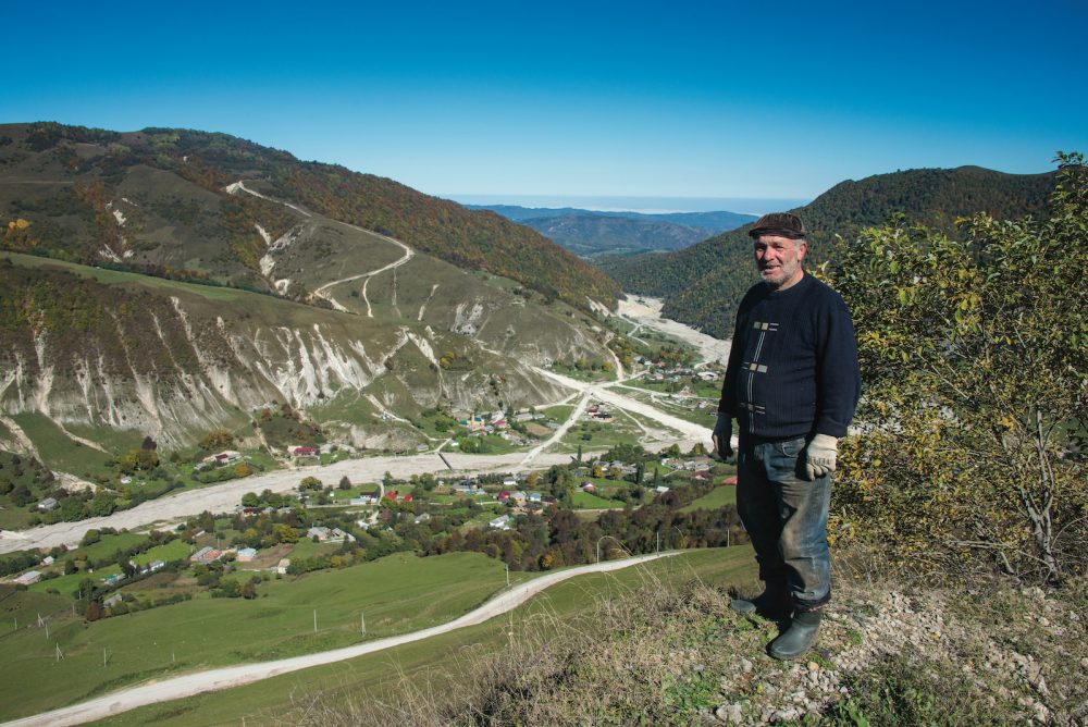 Man overlooking village in Caucasus