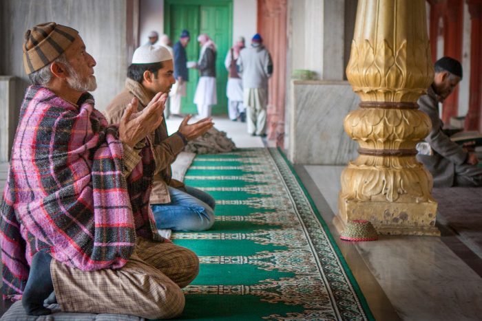 Muslim man praying in a mosque