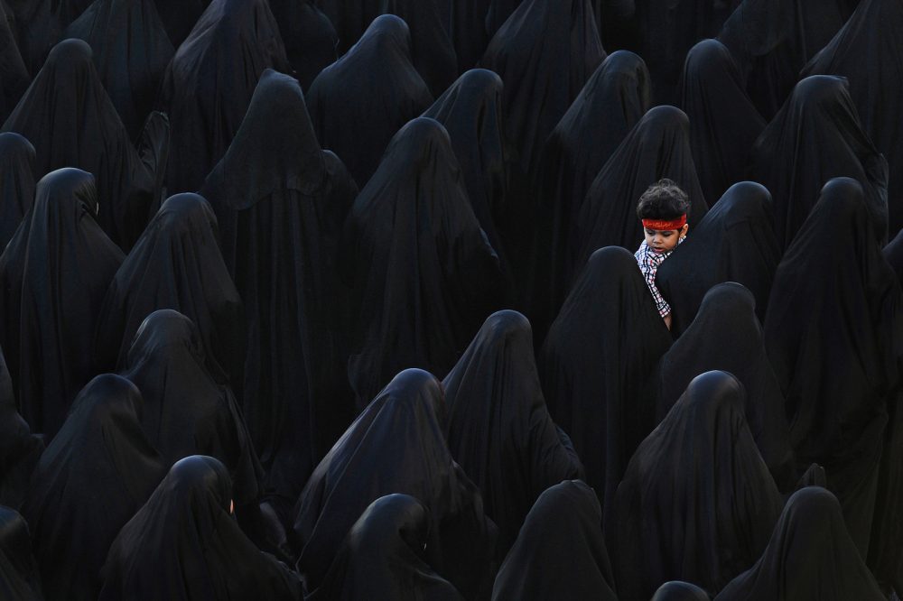 Women veiled in black for Ashura