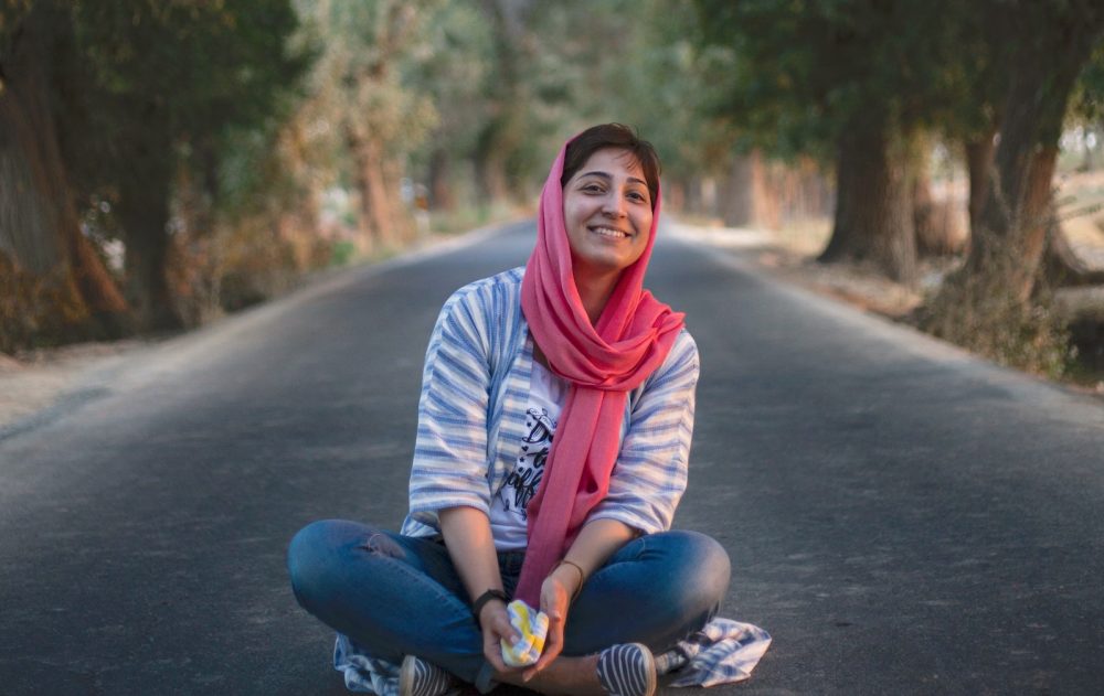 young smiling woman in a park