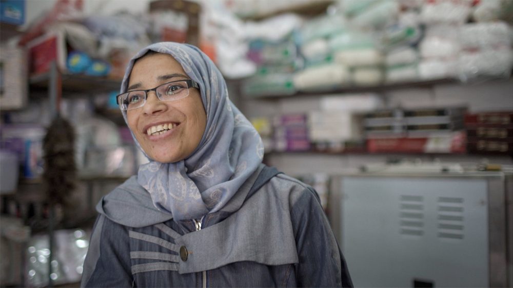 Smiling Syrian refugee woman