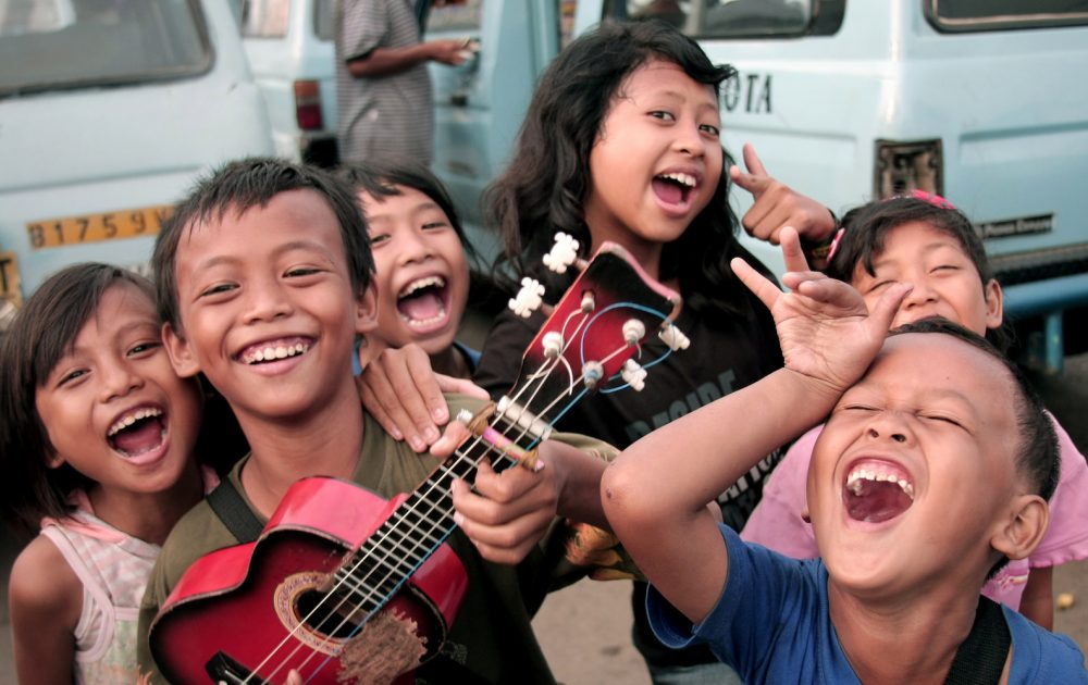 children laughing in a village