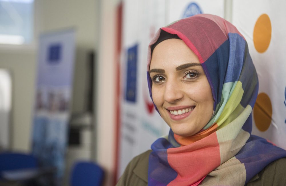 smiling young woman in colorful hijab